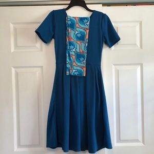 Blue Amelia dress and feather leggings